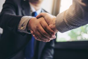 Two business men shaking hands during a negotiation